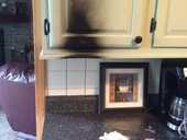Candle burst and caught cabinet on fire